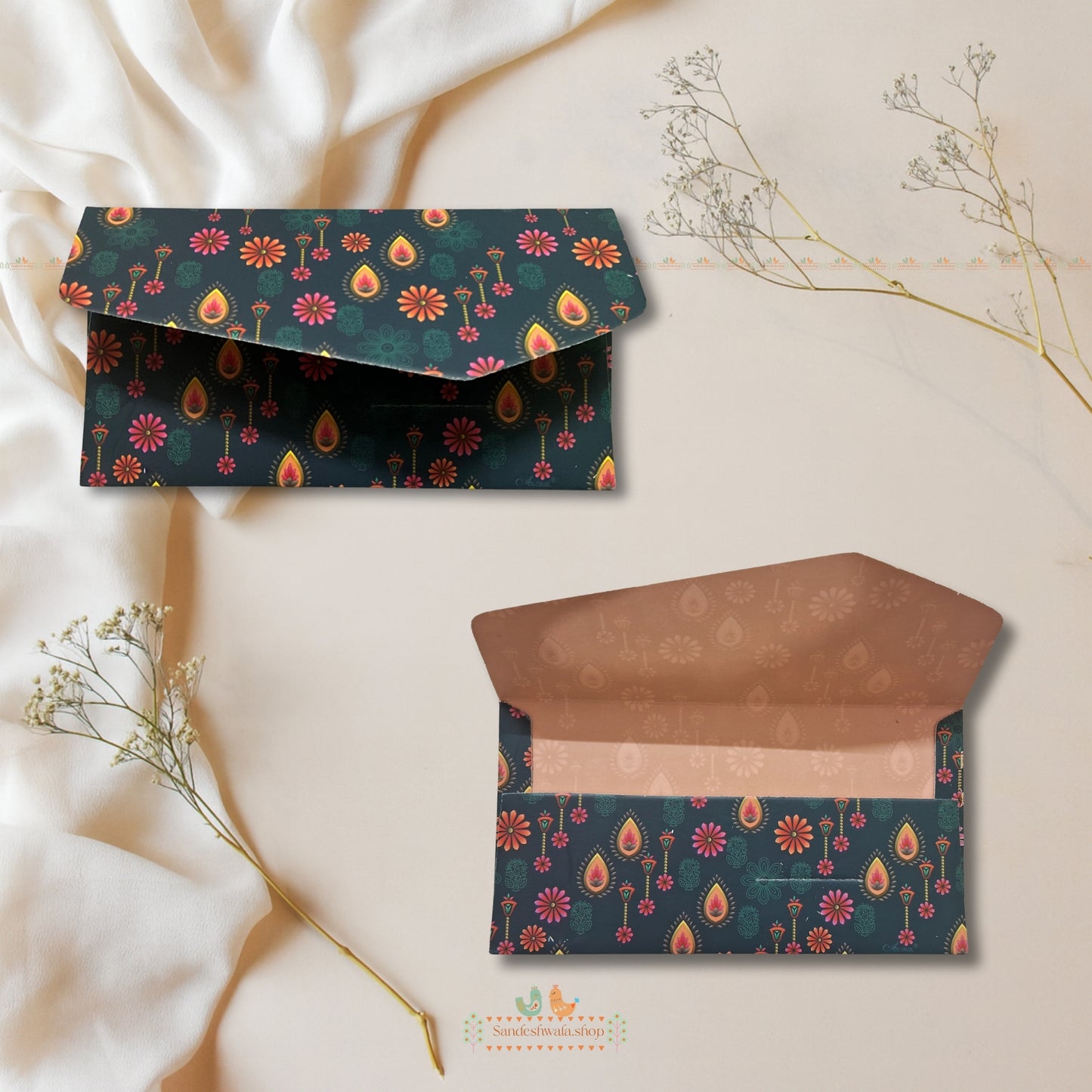 Decorative envelopes with floral patterns on a light background