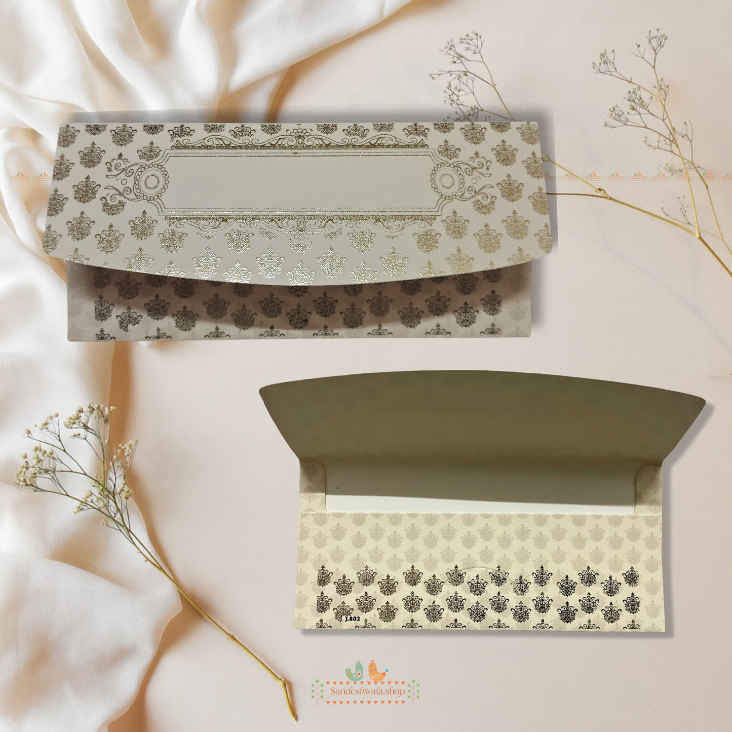 Decorative envelopes with floral patterns on a soft beige background