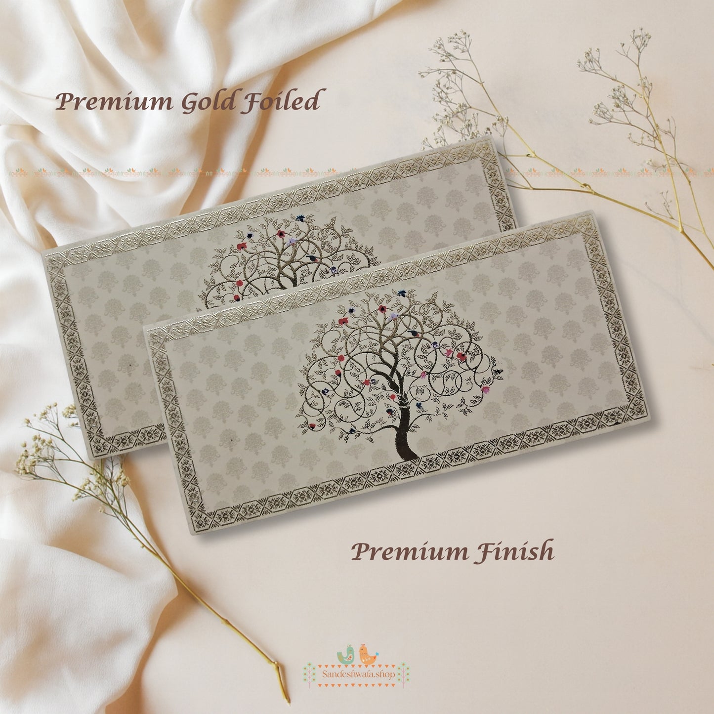 Two premium gold-foiled cards with a tree design on a soft beige background.